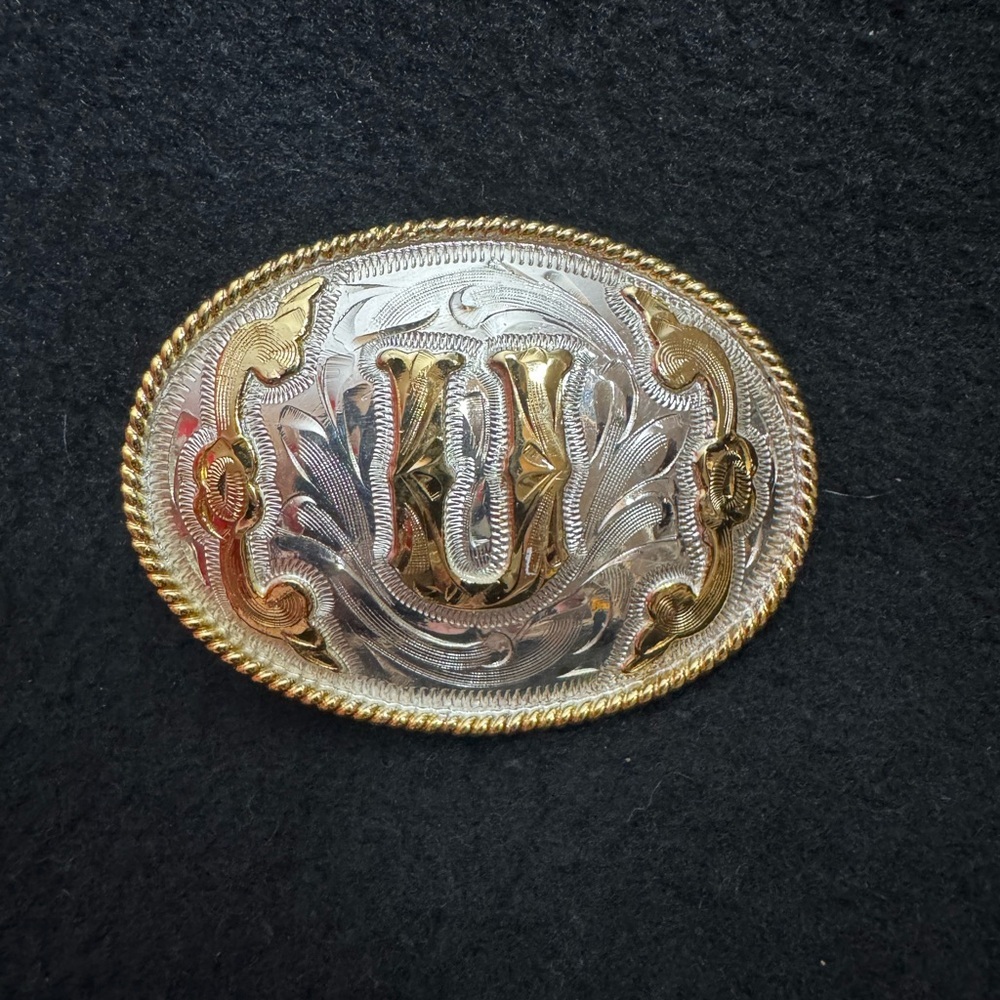 Gold and Silver Western Belt Buckle with the letter “U”